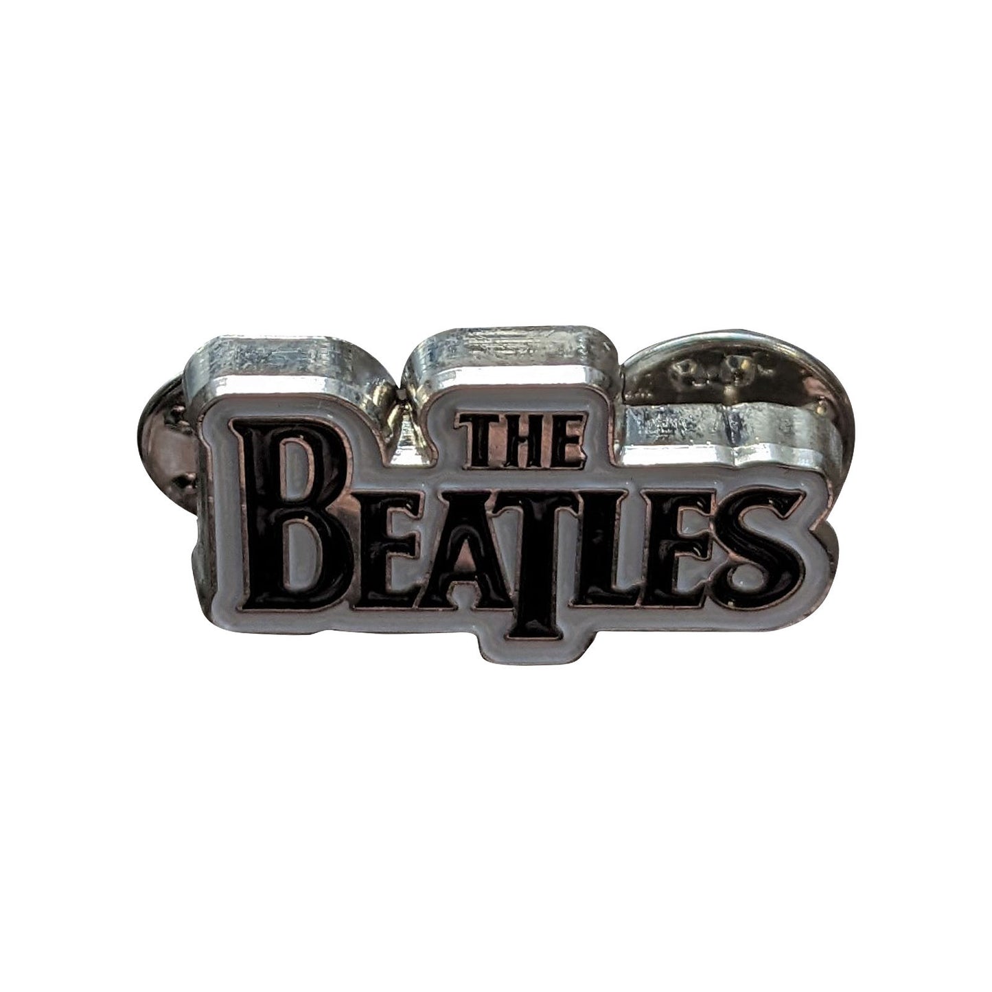 Een foto van een The Beatles Speld