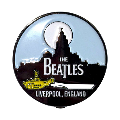 Een foto van een The Beatles Speld Badge
