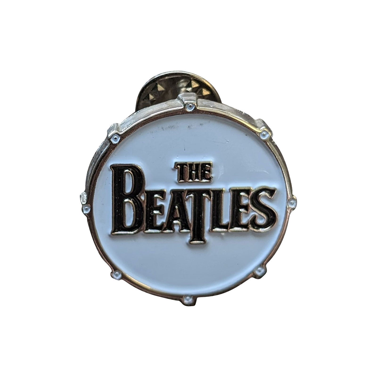 Een foto van een The Beatles Speld Badge