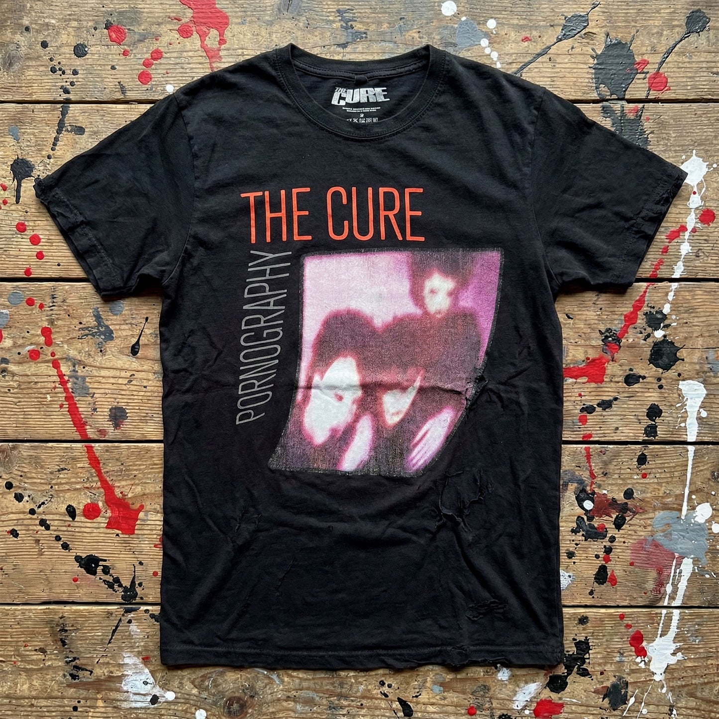 Een foto van een The Cure T-Shirt
