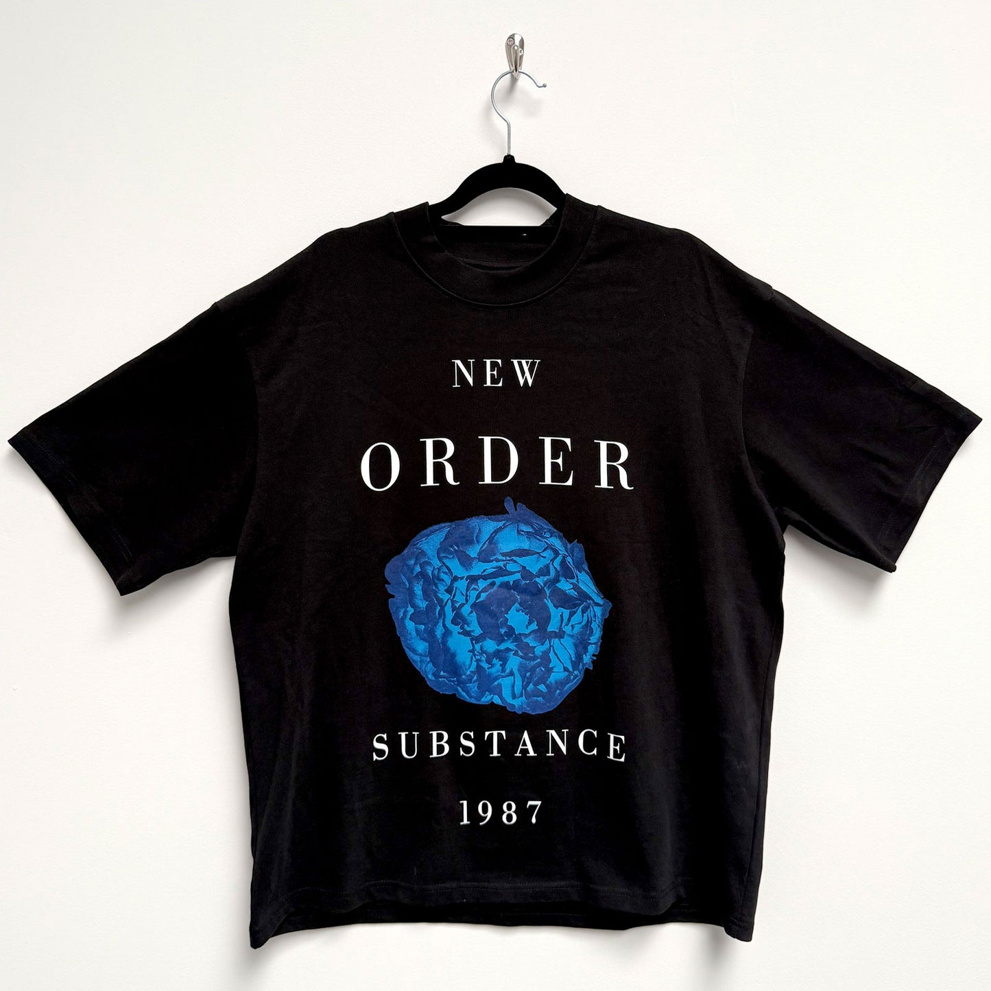 Een foto van een New Order T-Shirt